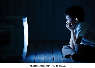 Little Boy Watching TV One Night On The Floor