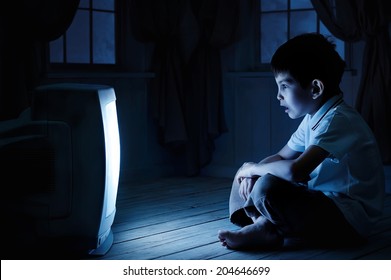 Little Boy Watching TV One Night On The Floor