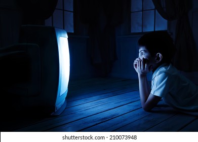 Little Boy Watching TV One Night On The Floor