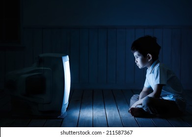 Little Boy Watching TV One Night On The Floor