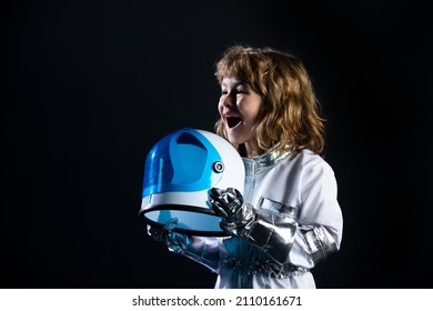 Little Boy Wearing An Astronaut Helmet Costume And. Cute Kid In Astronaut Playing And Dreaming Of Becoming A Spacemen.