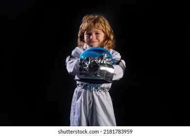 Little Boy Wearing An Astronaut Helmet Costume And. Cute Kid In Astronaut Playing And Dreaming Of Becoming A Spacemen.