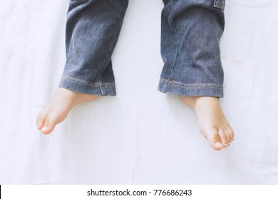 Feet in jeans