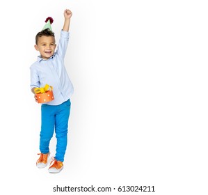 Little Boy Wearing Party Hat Hand Holding Gift Studio Portrait