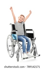 Little Boy In Wheelchair On White Background