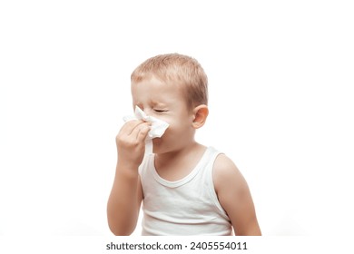 a little boy wipes his nose with a wet napkin on white background, Hygiene wet wipes carefully, - Powered by Shutterstock