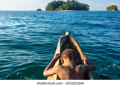 The Little Boy In Wooden Canoe