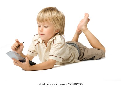 Little boy working with PDA, studio shot