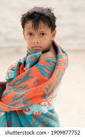 Little Boy Wrapped In A Beach Towel Standing Near River And Looking At Camera, Portrait Of Kid In The Summer, Childhood Concept - Image