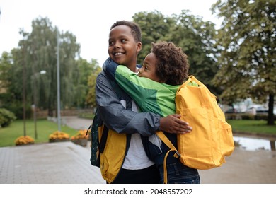 Little Boys Hug. Two African American Boys Next To The School. Back To The School Concept. Kids Standing Outside And Happy To Meet Each Others. Happy Black Children. First Day Of School