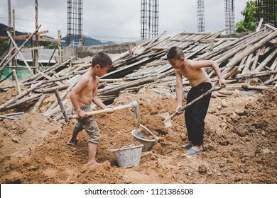 Little boys labor working in commercial building structure, World Day Against Child Labour concept.