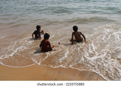 Little boys playing at the beach - Shutterstock ID 2233755885
