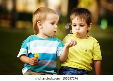 little boys playing with bubbles