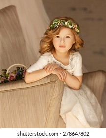 Little Bridesmaid Sitting On A Chair