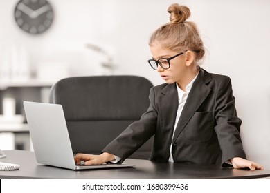 Little Businesswoman With Laptop Working In Office