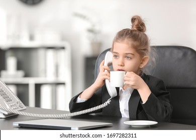 Little Businesswoman Talking By Telephone In Office