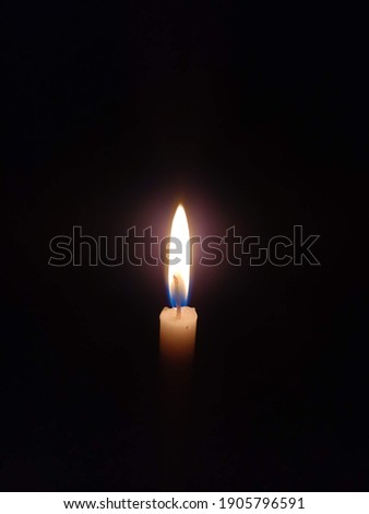 little candle in the dark room