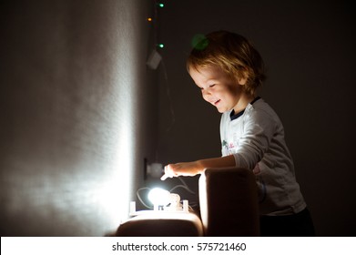 little cheerful child surprised bulb burning