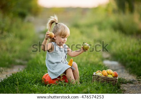 Similar – Image, Stock Photo Little girl looking apples in basket with harvest