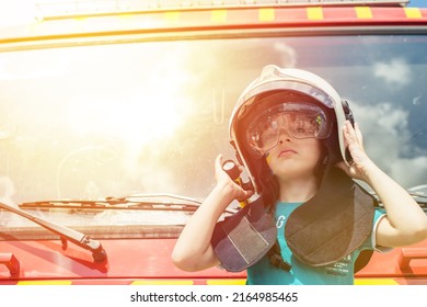 Little Child Boy In A Fire Helmet