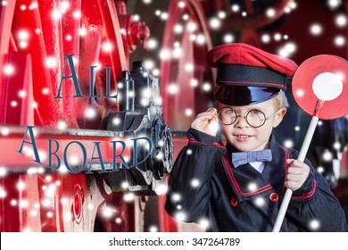 Little Child Boy In Winter As Nostalgic Railroad Conductor Beside Large Wheels Of A Steam Locomotive With Snowflakes And Text Request Call (blue)/Smiling Train Conductor Boy In Winter - All Aboard