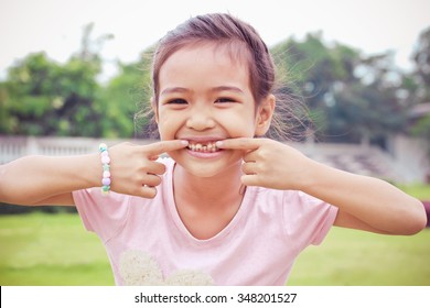 Little Child With Broken Teeth.