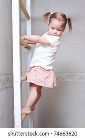 Little Child With Bunches Playing Sports And Climbing The Stairs. Healthy Lifestyle From Childhood