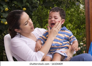 Little Child Crying With The Mom