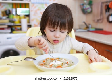 Little Child Eating Scrambled Eggs. Healthy Nutrition