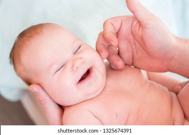 Little Child, The Girl Lies In The Hands Of Her Father. The Child Has Excess Weight And Fat Folds, Requires Dietary Nutrition. The Girl Laughs And Rejoices In Life. Dad Caresses Baby, Tickle Her Cheek