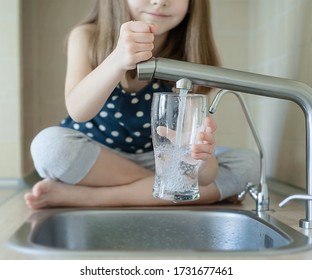 Little Child Open Water Tap. Kitchen Faucet. Glass Of Clean Water. Pouring Fresh Drink. Hydration. Healthy Lifestyle. Good Habit. Water Quality Check. World Water Monitoring Day. Plastic Free Concept