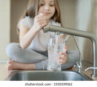 Little Child Open Water Tap. Kitchen Faucet. Glass Of Clean Water. Pouring Fresh Drink. Hydration. Healthy Lifestyle. Good Habit. Water Quality Check. World Water Monitoring Day. Plastic Free Concept