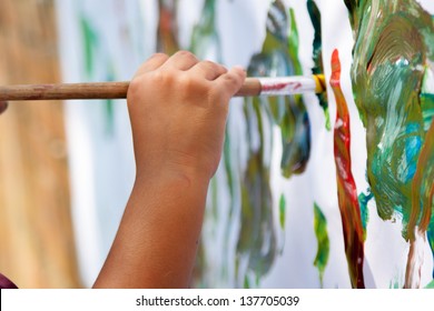 Little Child Painting With  Brush