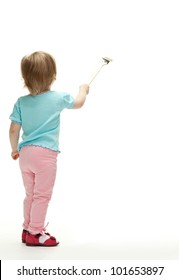 Little Child Painting White Wall With A Paintbrush, Rear View Full Length Portrait