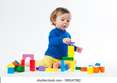 Little child playing with dices isolated on white background - Powered by Shutterstock