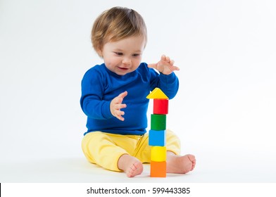 Little child playing with dices isolated on white background - Powered by Shutterstock