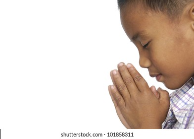 Little Child Praying Over White Background.