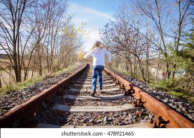 Little Child Running In Railway Back View