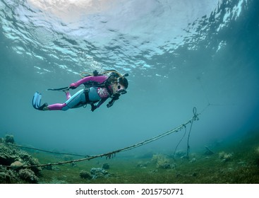 Little Child Scuba Diver Underwater In The Sea