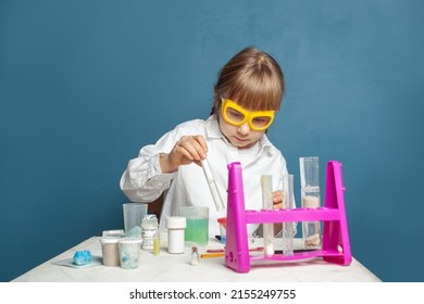 Little Child Student Doing A Chemical Experiment And Holding Flask In Hand In Science Class. Education And Science Concept