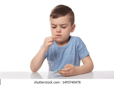 Little Child Taking Pill On White Background. Household Danger