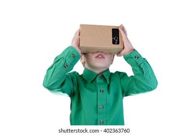 Little Child Uses Virtual Reality (VR Cardboard) Isolated On White Background