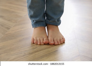 Little child walking barefoot at home, closeup. Floor heating concept - Powered by Shutterstock