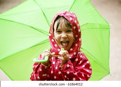 Little Child Walking In The Rain