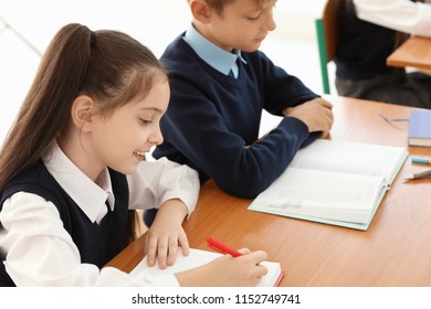 Little Children In Classroom. Stylish School Uniform