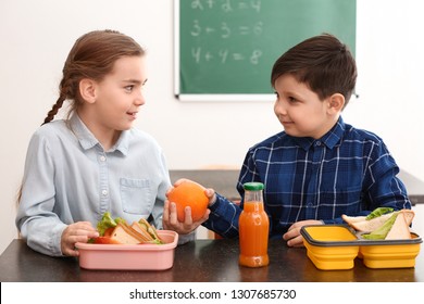 Little children having lunch in classroom - Powered by Shutterstock