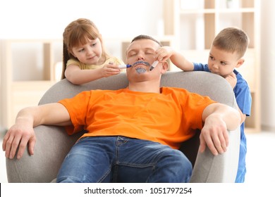 Little Children Painting Their Father's Face While He Sleeping. April Fool's Day Prank