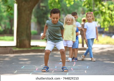 Little Children Playing Hopscotch, Outdoors