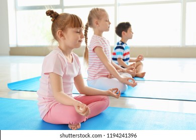 Little Children Practicing Yoga Indoors