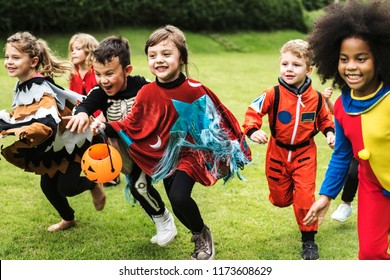 Little Children Trick Or Treating On Halloween